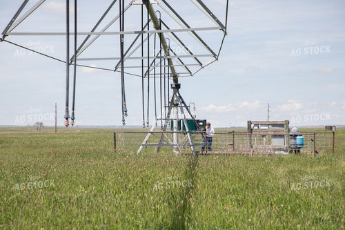 Farmer Checking Pivots 117062