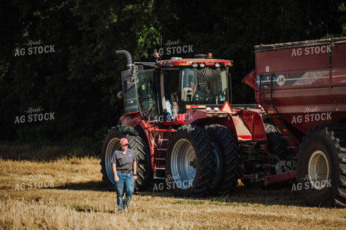 Female Farmer Walking by Tractor 115212