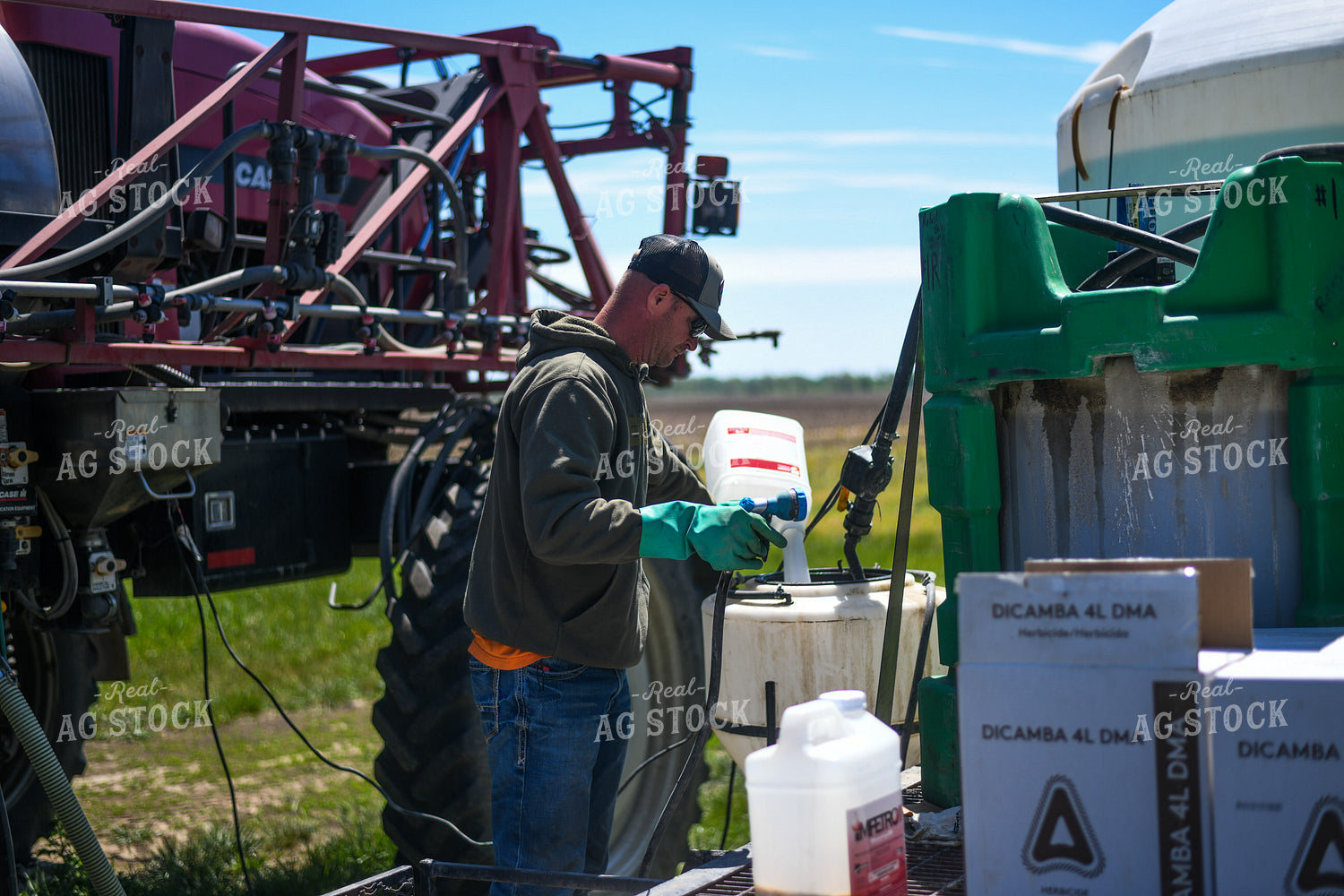 Farmer Mixing Chemicals for Self Propelled Sprayer 191060