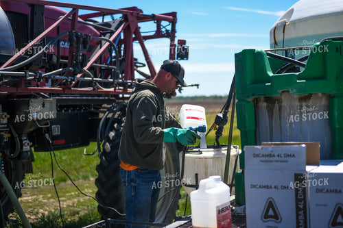 Farmer Mixing Chemicals for Self Propelled Sprayer 191060