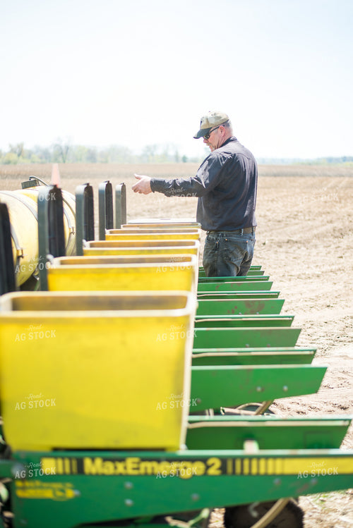 Farmer with Seed Boxes on Planter 74043