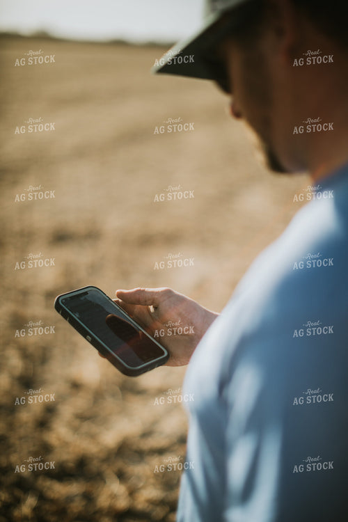 Farmer on Phone in Field 7138