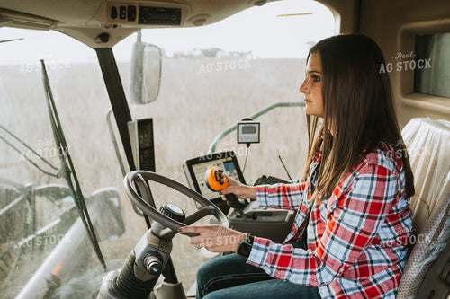 Female Farmer Driving Combine 3491