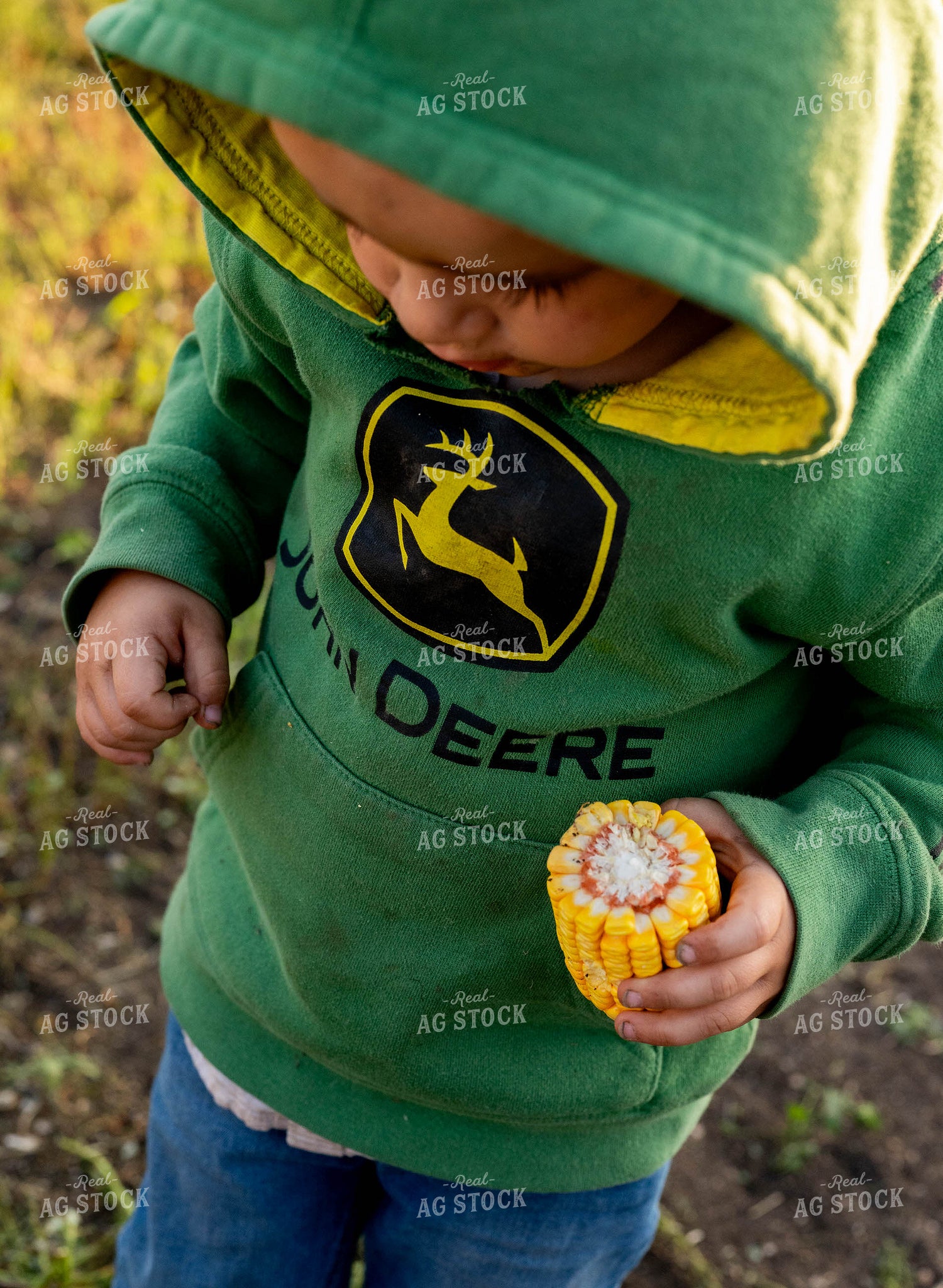 Farm Kid Holding Ear of Corn 185045