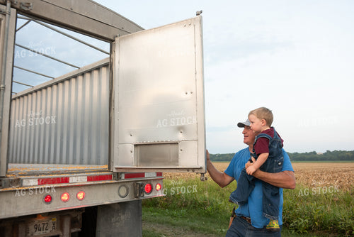 Farmer and Grandson in Field with Semi Truck 129072