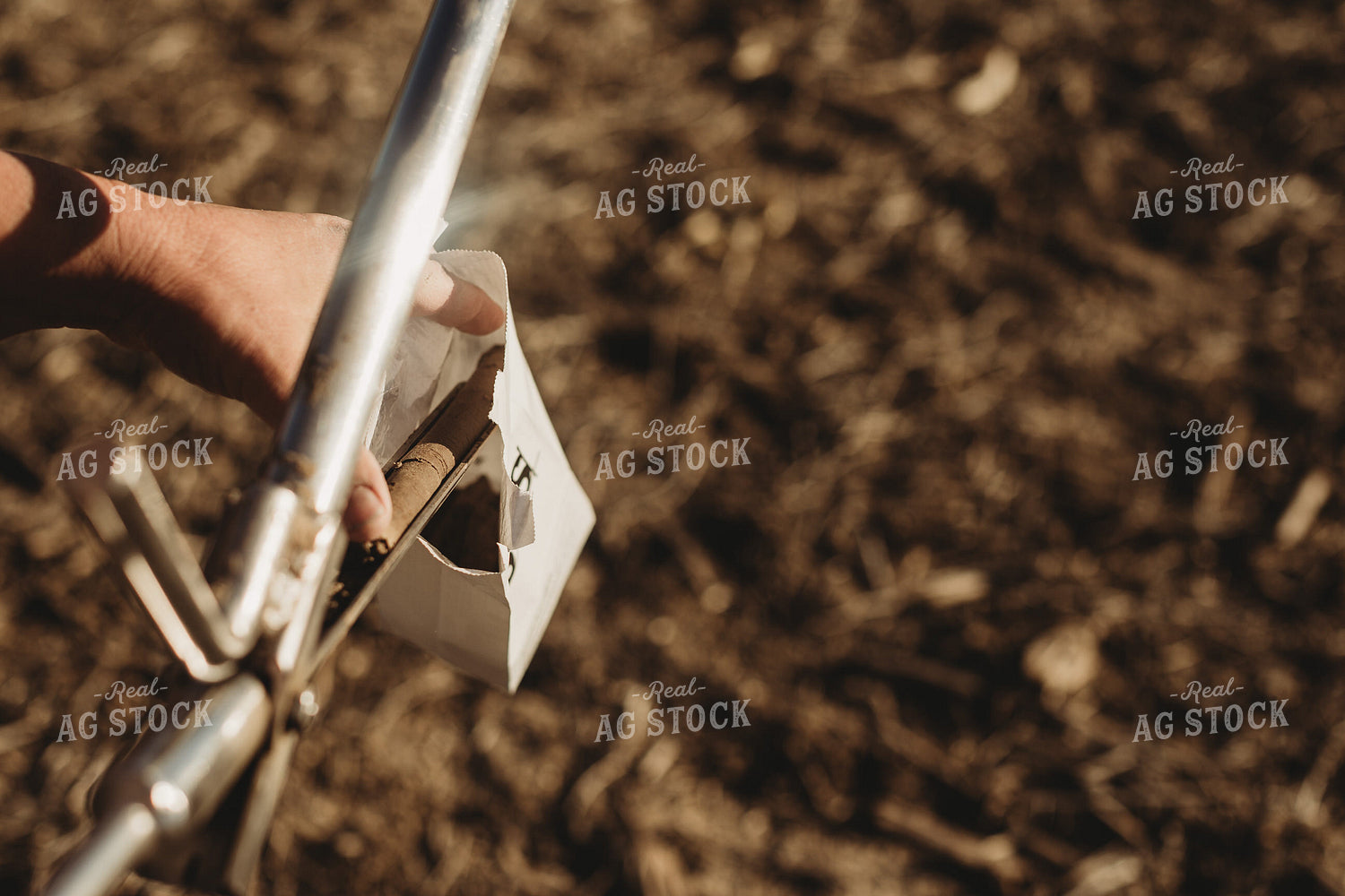 Farmer Putting Soil Core in Soil Sample Bag 3717