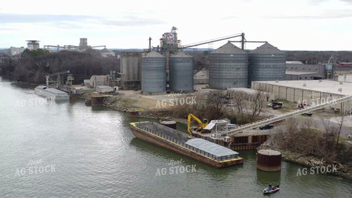 Aerial of Unloading Dry Fertilizer off of River Barge 79206