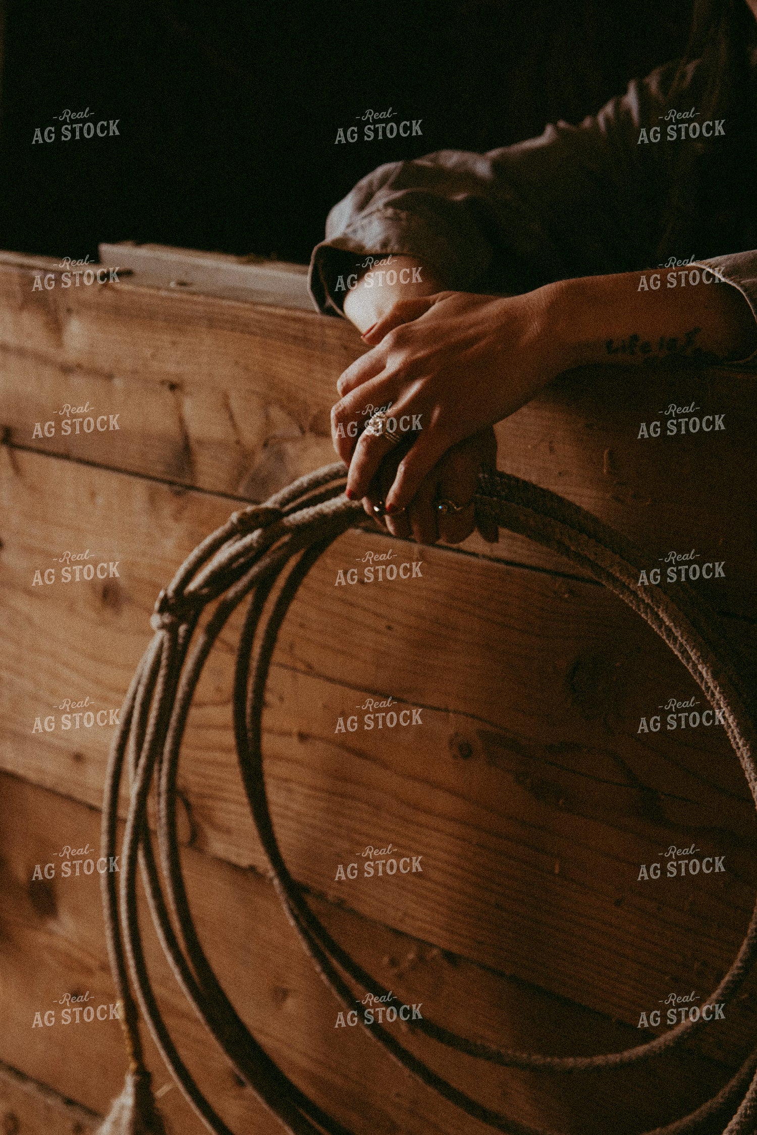 Female Rancher Holding Lasso 67897