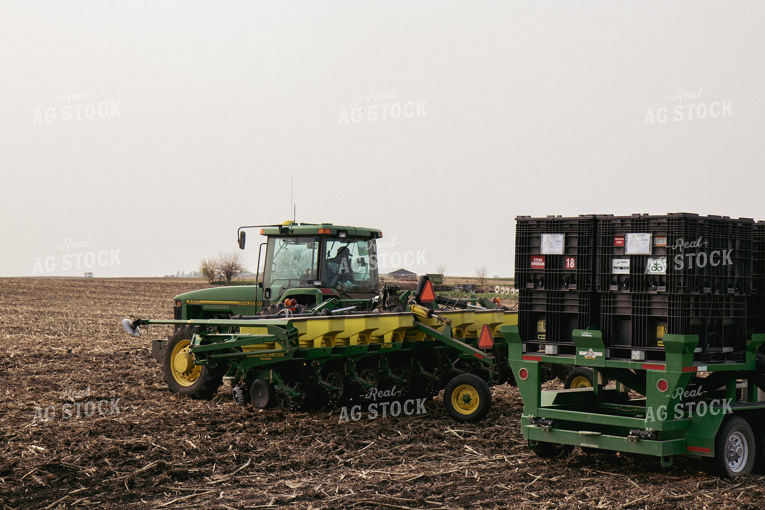 Farmer Backs Tractor and Planter Up to Seed Tender 67295