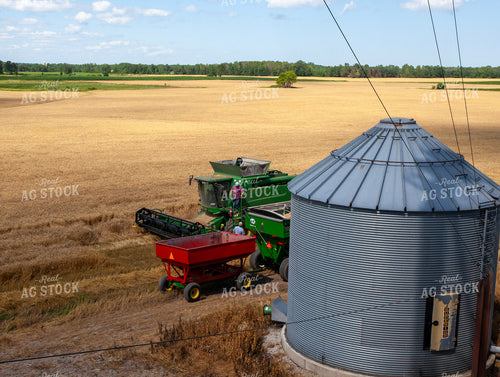 Farmers Talking by Equipment During Wheat Harvest 132069