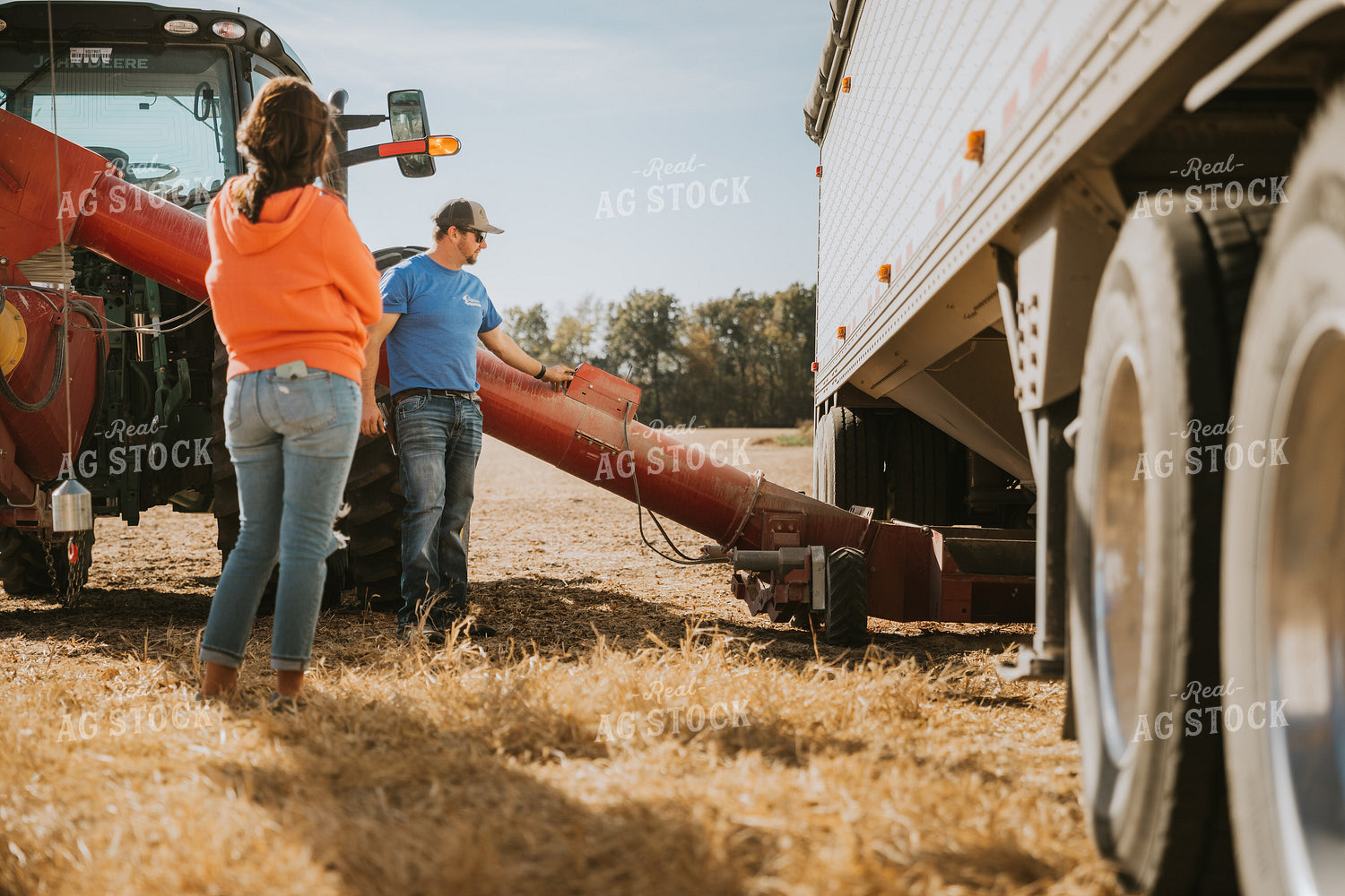 Farmers Setting Up Auger 7060