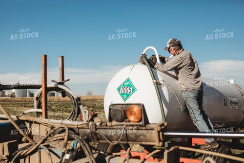 Farmer Hooking Up Anhydrous Ammonia Tank 3571