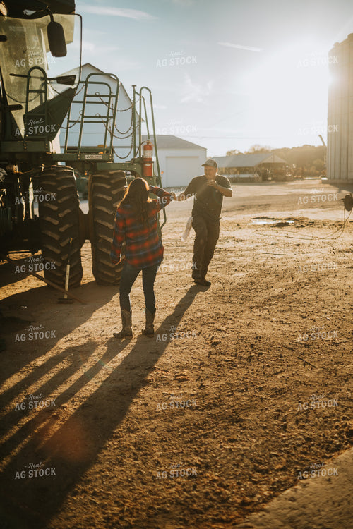 Farmer and Farm Wife with Combine 5050