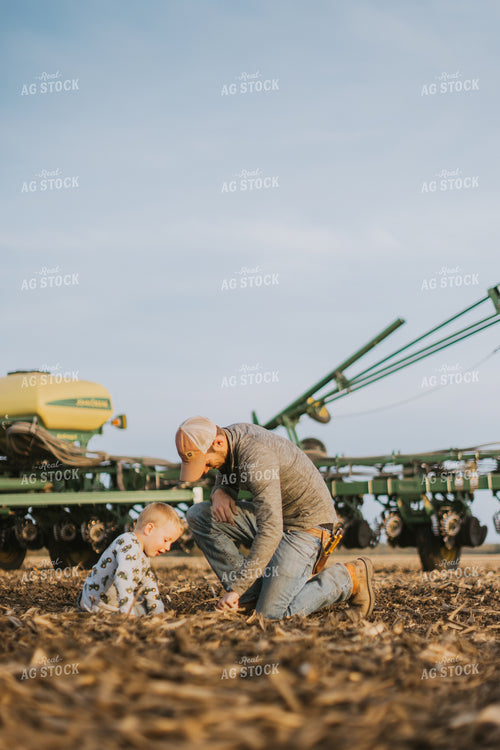 Farmer Checking Seed Depth with Son 8219