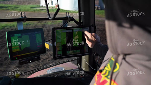 Farmer in the Tractor Cab with Technology - 049
