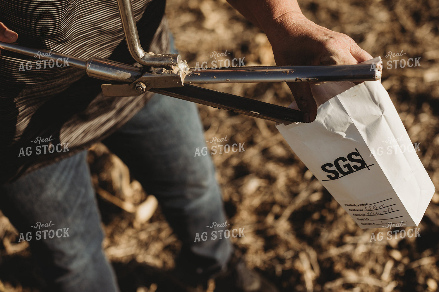 Farmer Opening Soil Sampling Probe with Soil Core 3714