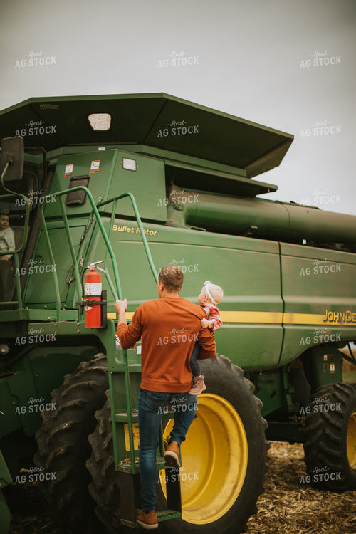 Farmer and Farm Kid Getting in Combine 6674