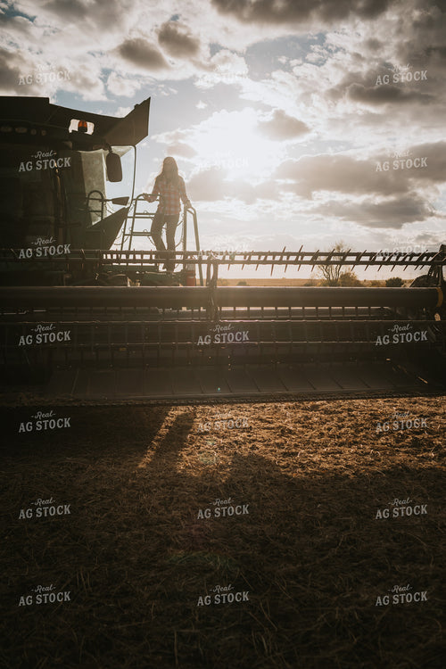Female Farmer Getting into Combine 3525