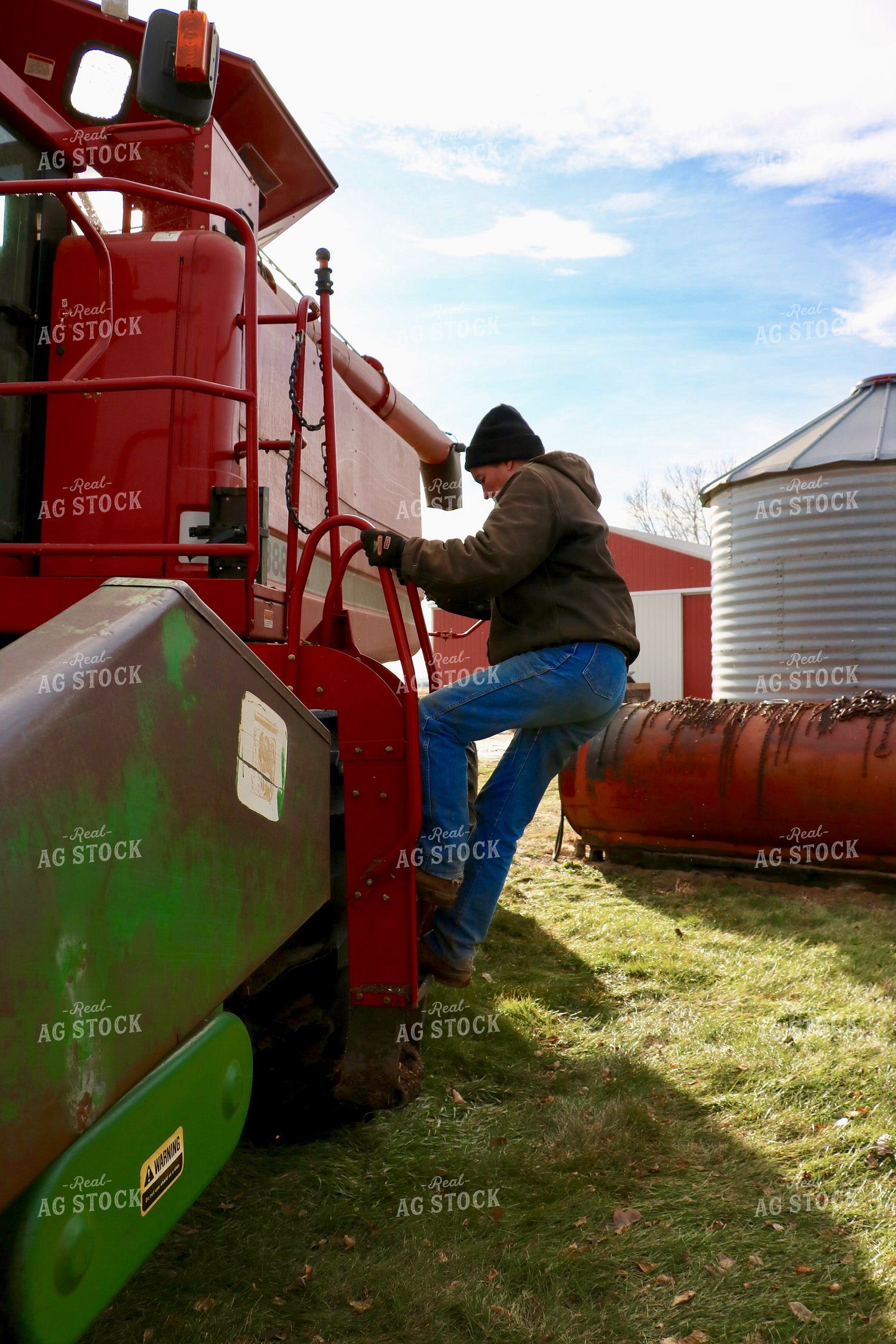 Farmer Climbing in Combine 299288