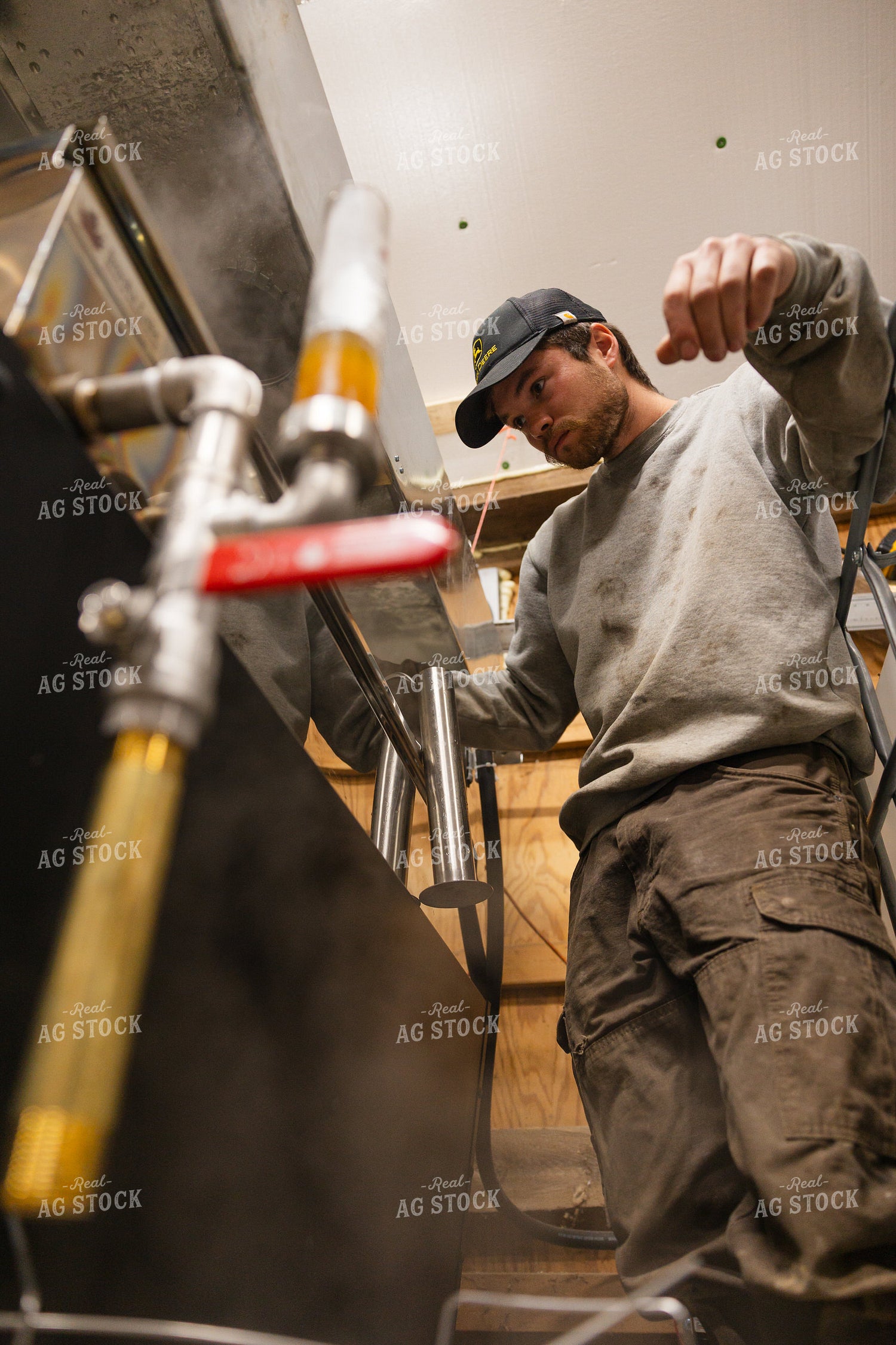 Farmer Cooking Maple Syrup 52817