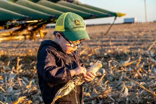 Farm Kid Holding Ear of Corn 65113