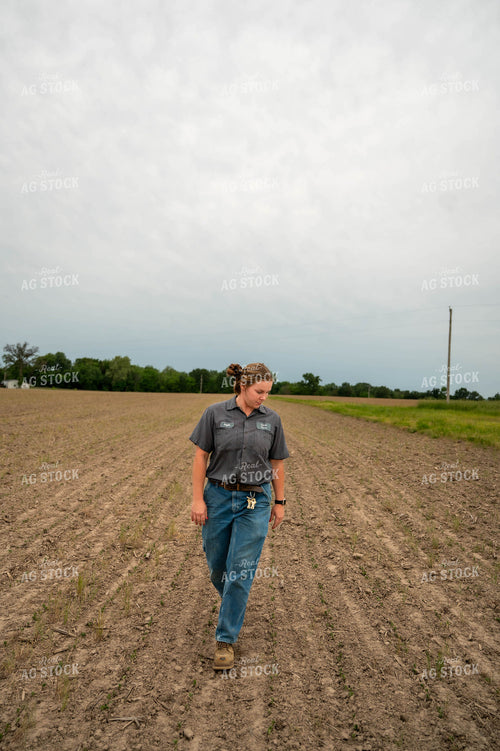 Female Farmer Walking in Field 115723