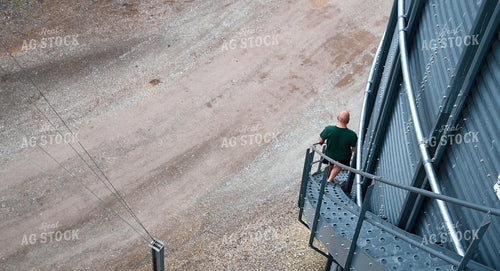 Farmer Climbing Grain Bin 25308