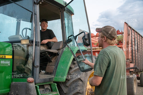 Farmer in Tractor Talking to Farmer 50262
