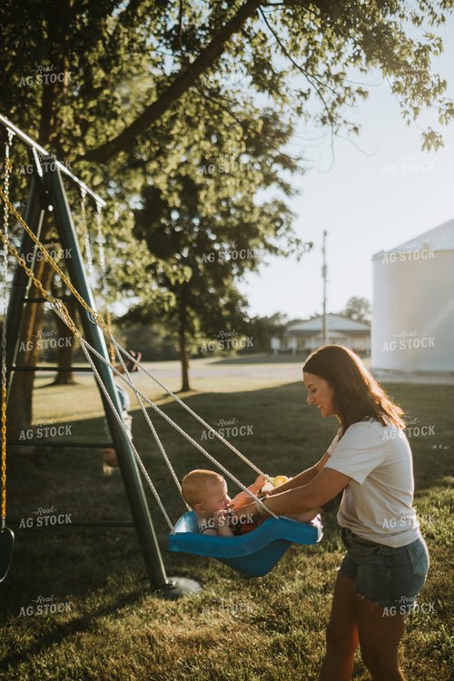 Farm Mom Pushing Kid in Swing 6257