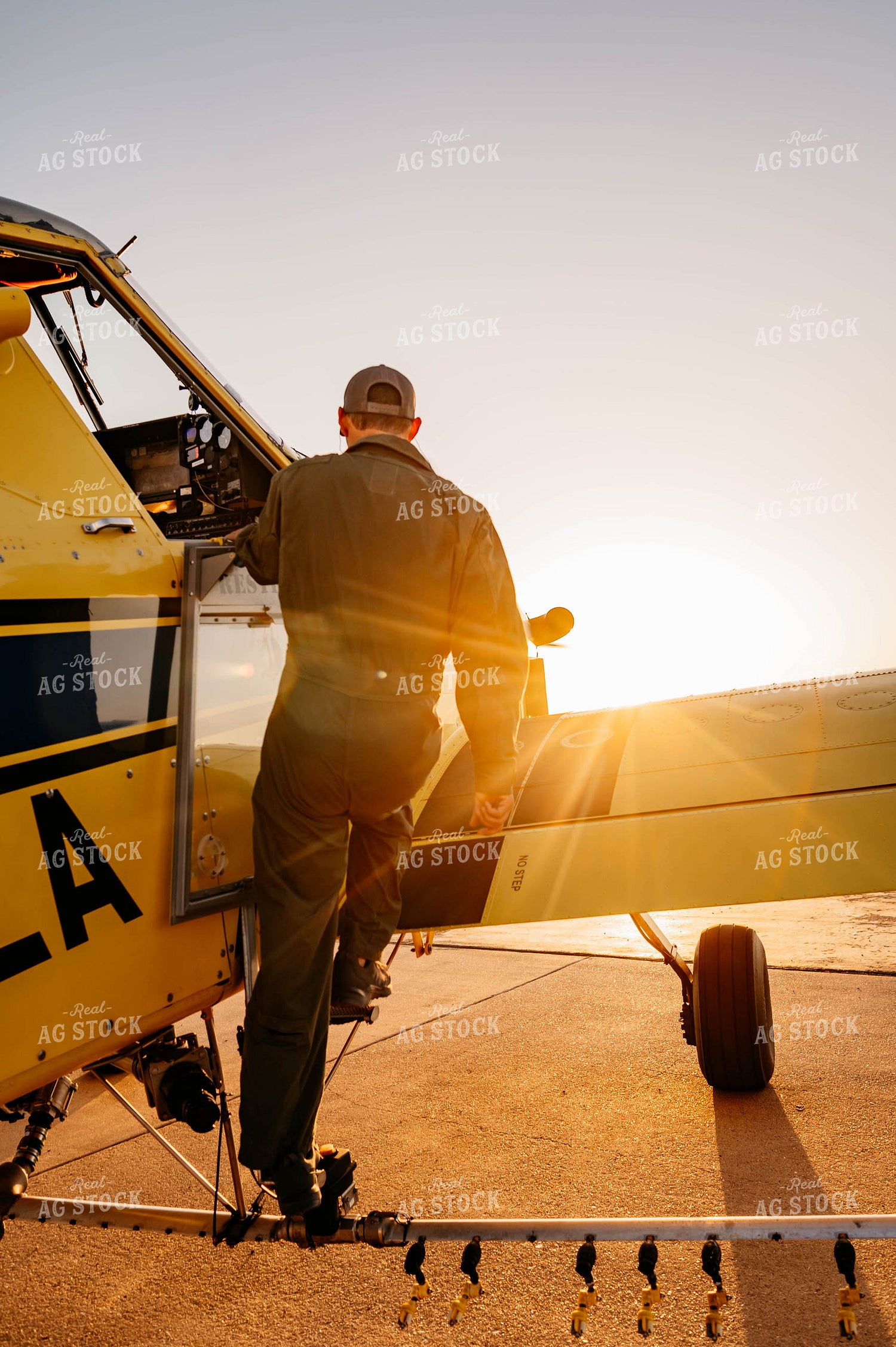 Applicator Climbing into Crop Duster 218011