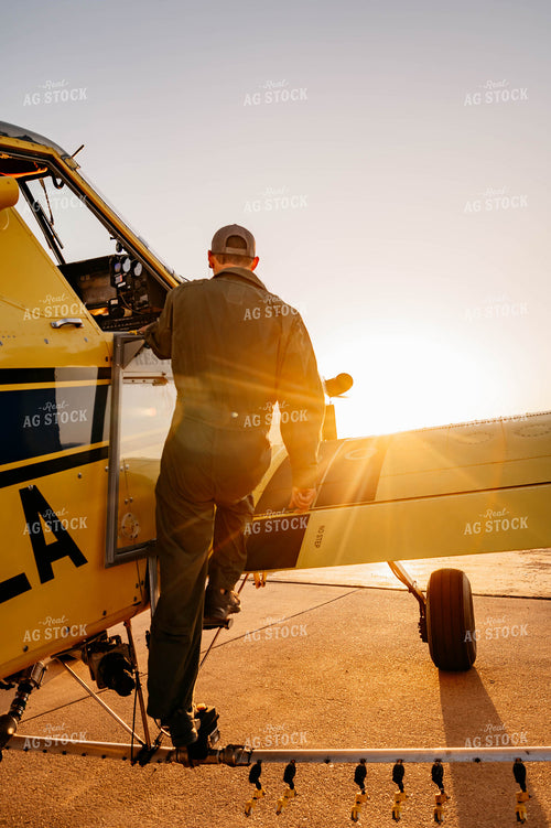 Applicator Climbing into Crop Duster 218011