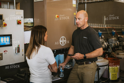 Farmers Talk in Shed While Treating Seed 7572
