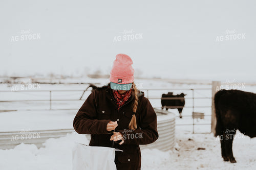 Female Rancher Feeding Supplements 61191