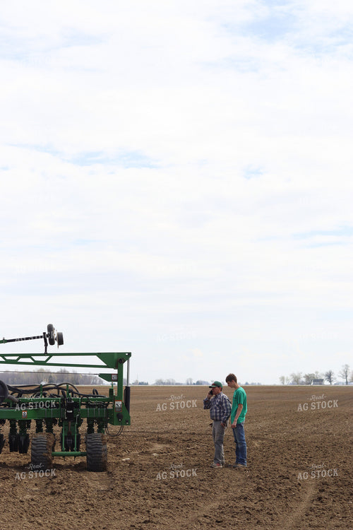 Farmers Standing Around Planter 109077