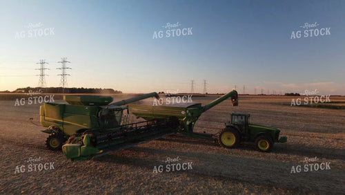 Aerial Drone of Soybean Harvest Combine Unloading at Sunset 7367