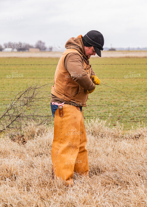 Rancher Fixing Fence 231070