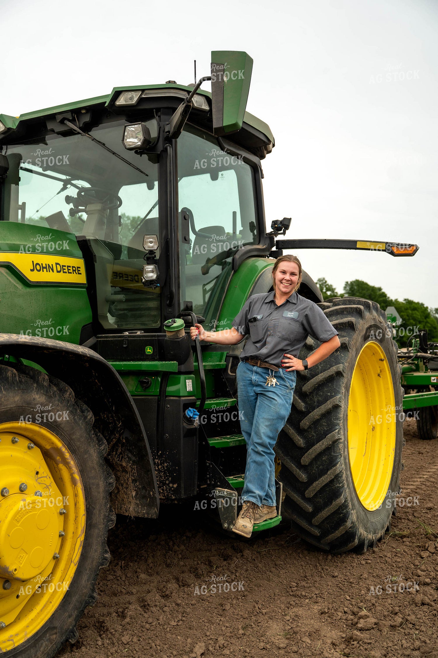 Female Farmer Climbing into Planter 115690