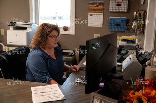 Female Farmer Working on Computer 115531