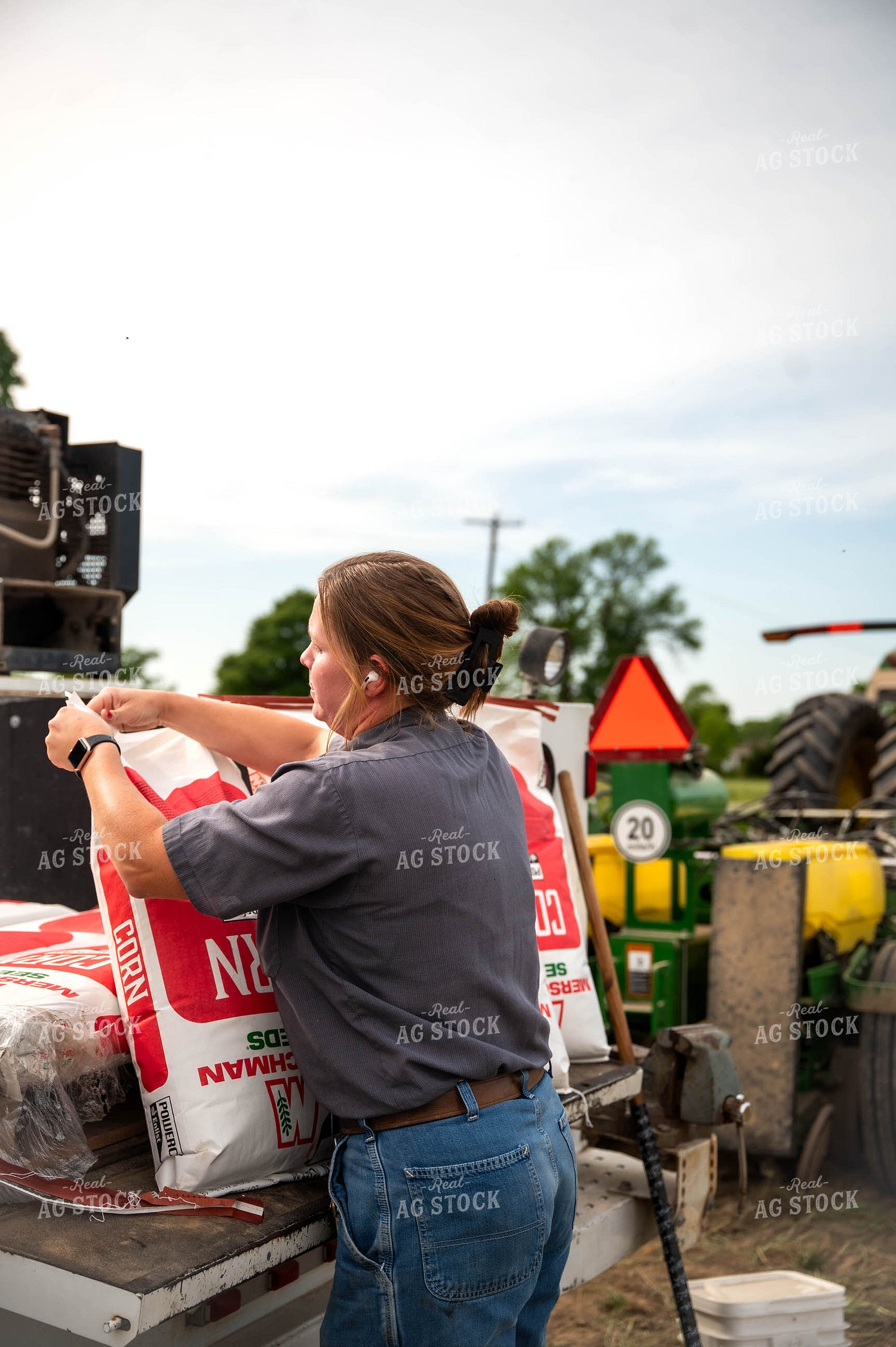 Female Farmer Filling Planter 115625