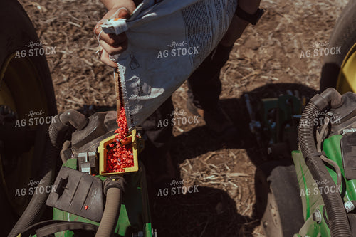 Farmer Filling Planter for Test Plot 196120