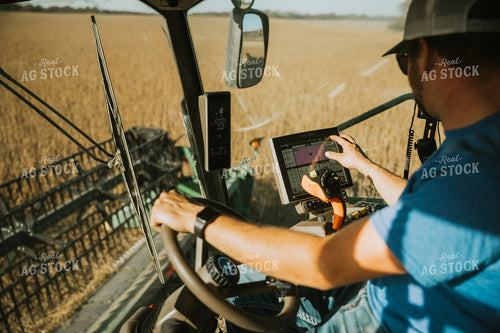 Farmer Operating Combine 7106
