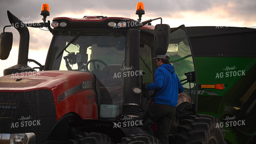 Farmer Climbing into Tractor Cab 25729