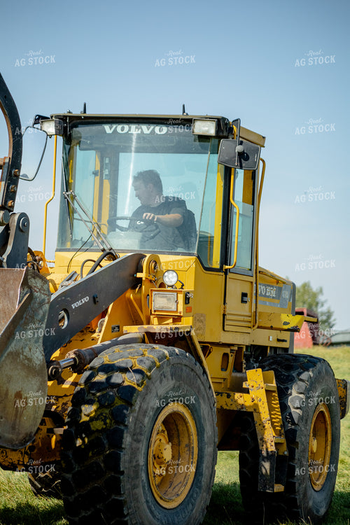 Farmer Running Front End Loader 155285