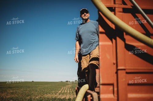 Farmer in Tandem Water Truck Filling Sprayer 4377