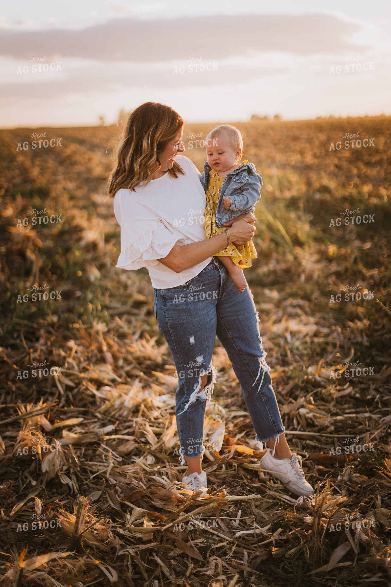 Farm Wife Holding Daughter in Field 9379