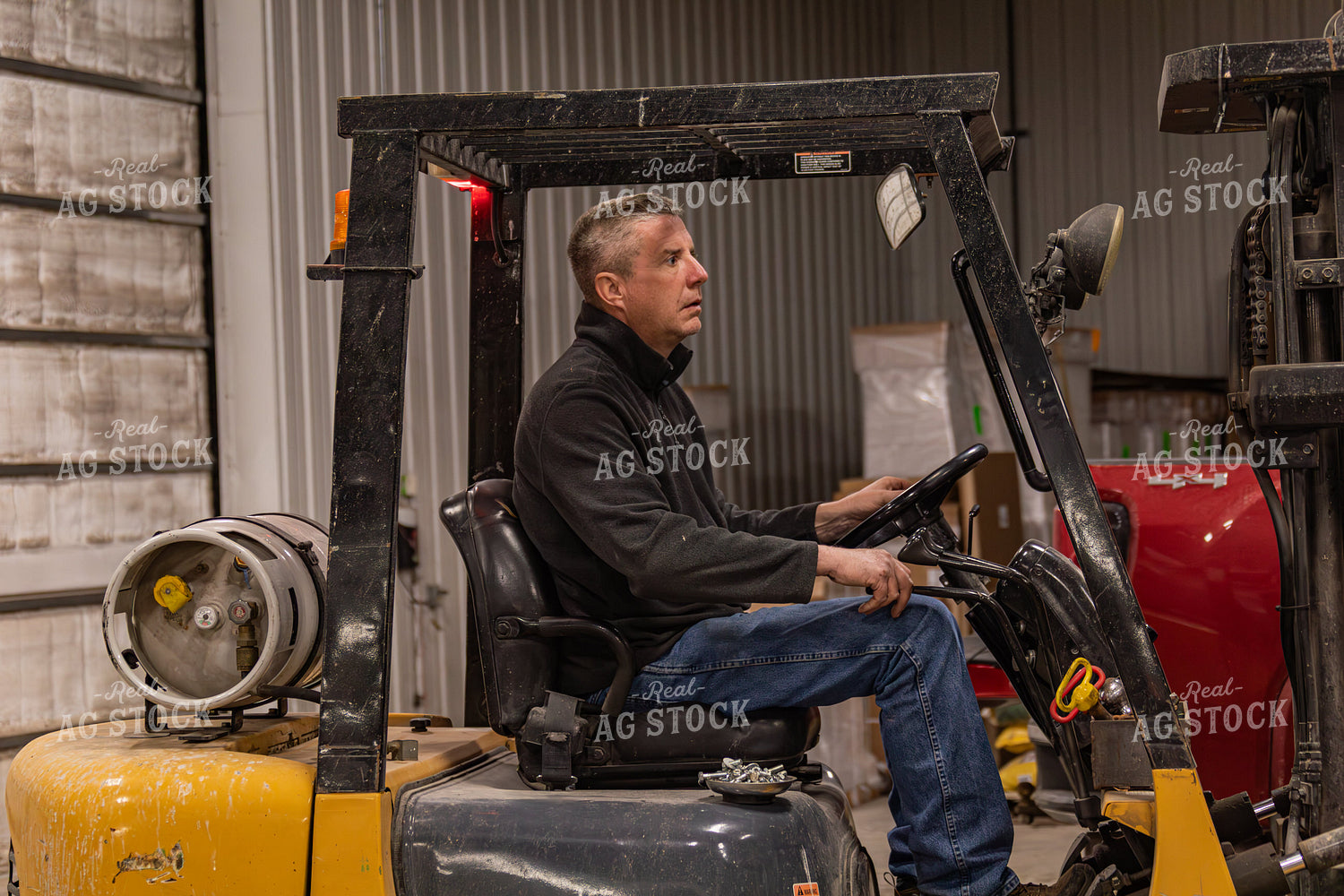 Farmer Driving Skid Steer 231124
