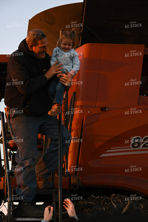 Farm Family Climbing Out of Combine 26308