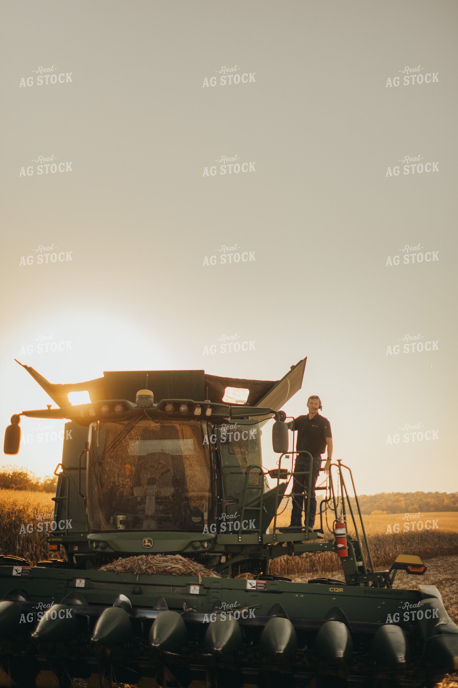 Farmer Standing on Combine 9498