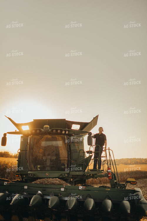 Farmer Standing on Combine 9498