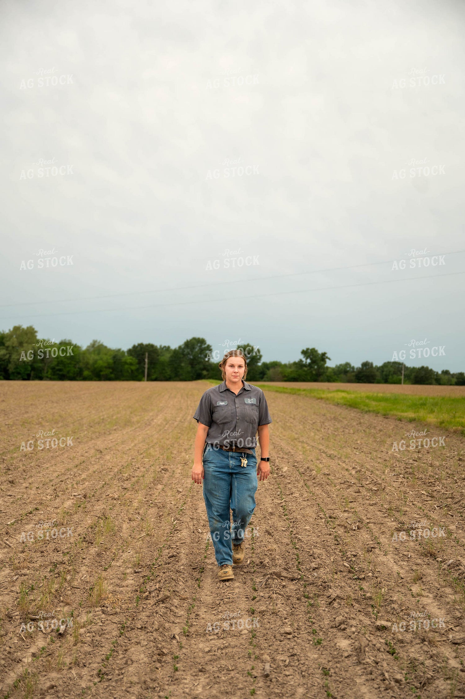 Female Farmer Walking in Field 115721